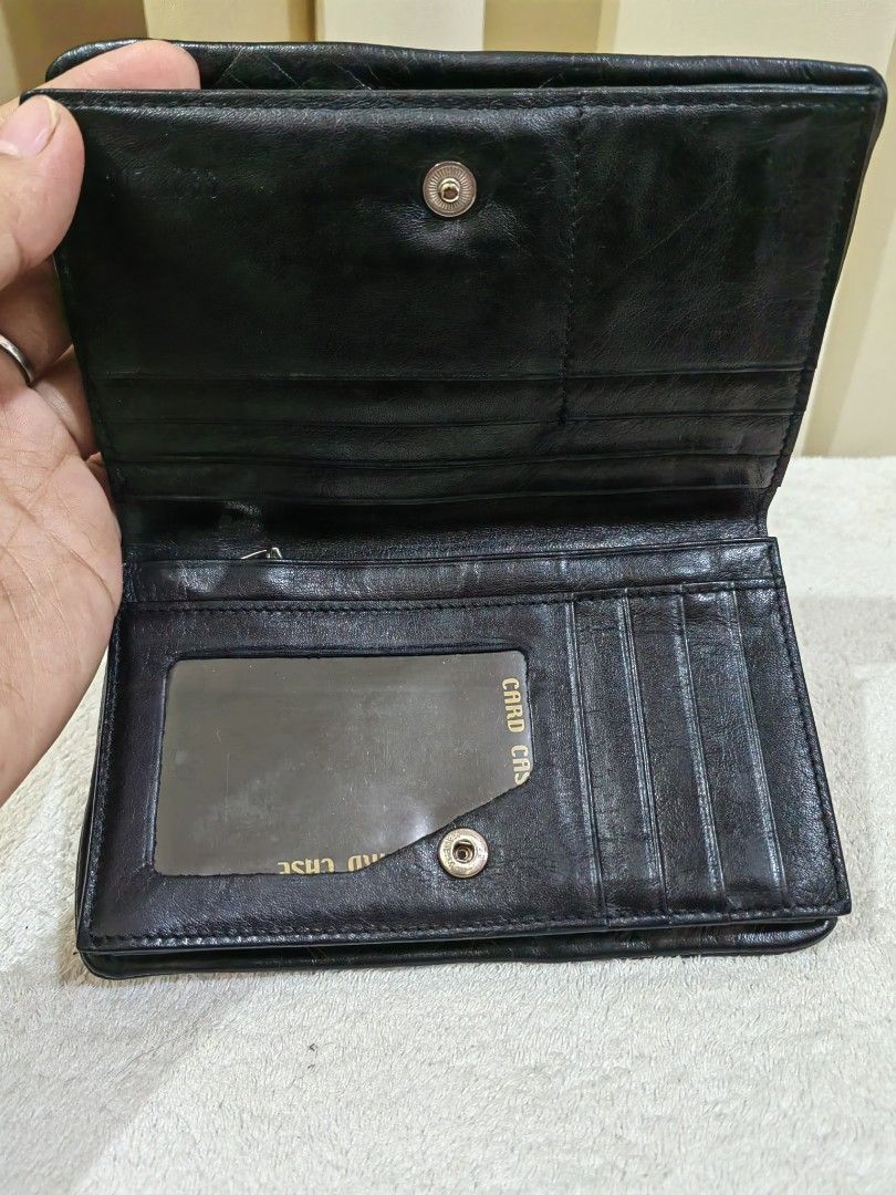 Black Leather Wallet with Multiple Compartments (Category: Wallets & Card holders) located in Makati City. Submitted by prelovedtreatedwithlove (Listing ID 1458589630, Image 3). Description: - Black leather wallet - Zip pocket inside - Multiple card slots - Clear ID window - Secure snap closure - Functional, unique wallet - quadfold,. Medium size -Genuine leather - No issue like new.