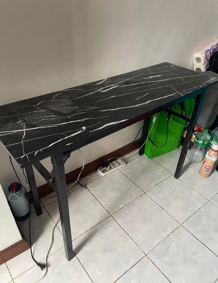 Black Marble Effect Study Desk (Category: Tables & Sets) located in Manila. Submitted by escolarch50458 (Listing ID 1458625947, Image 2). Description: - Sleek black marble effect top - Durable metal legs for stability - Ample surface area for work and study - Ideal for home office setups - Easy to wipe clean - Fits well in various spaces.