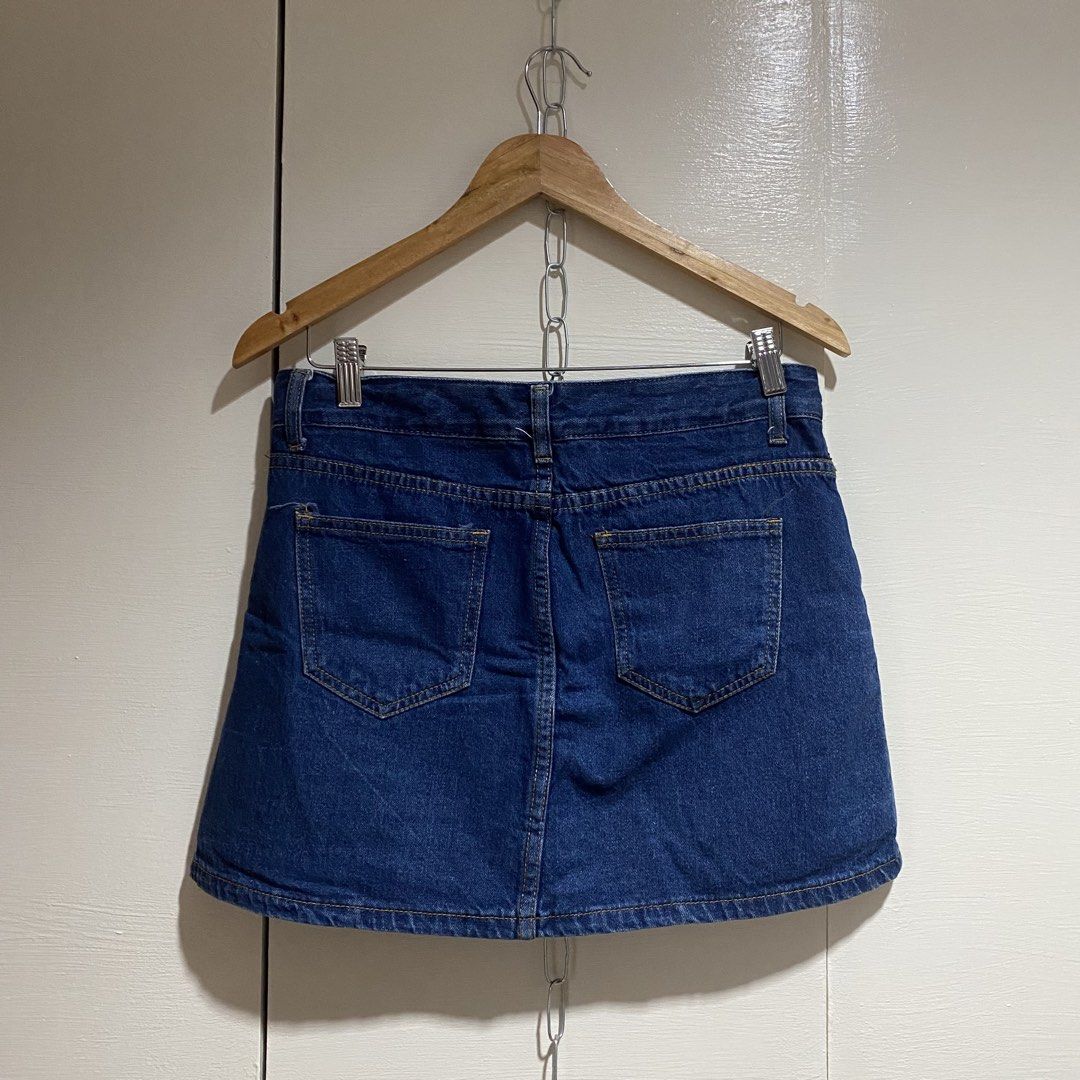 Blue Denim A-Line Mini Skirt (Category: Skirts) located in Cavite. Submitted by branchee_chic (Listing ID 1458572026, Image 3). Description: W:29-30 L: 14.5 Nawala yung puller bg zipper pls see photos - Classic blue denim mini skirt - A-line cut - Two front pockets - Two back pockets - Zipper and button front closure - Versatile and easy to style.