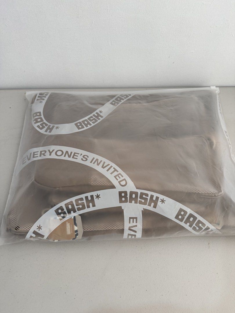 BRAND NEW BASH Packing Cubes Set - Taupe (Category: Luxury Bags & Wallets) located in Las Pinas. Submitted by tati_finds (Listing ID 1458671420, Image 2). Description: Brand new, comes with BASH Paper bag, perfect for gifting -No Issue, No signs of use -Selling at SRP Selling a set of BASH packing cubes. Comes in a Taupe color. Includes multiple sizes for organizing your luggage. Mesh panels on top for visibility. Zippers work smoothly. Great for