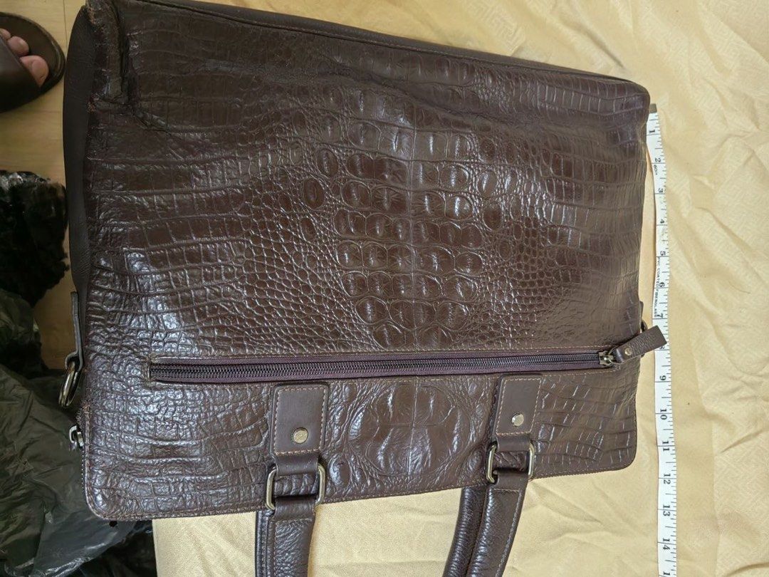 Brown Crocodile Embossed Leather Laptop Bag (Category: Laptop Bags & Sleeves) located in Manila. Submitted by junejanuary (Listing ID 1458500212, Image 2). Description: - Dark brown leather laptop bag - Crocodile embossed texture - Sturdy top handles - Detachable shoulder strap - Zip-top main compartment - Ample space for laptop and work essentials - Classic and professional design.