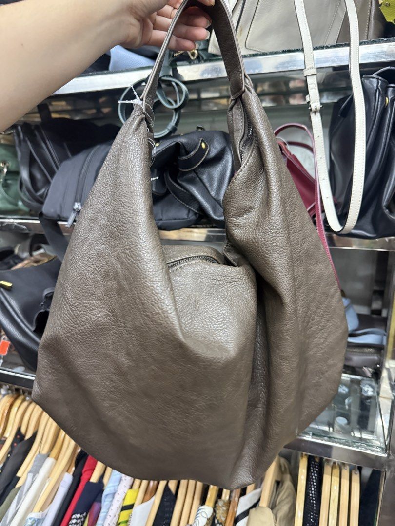 Brown Leather Hobo Bag (Category: Shoulder Bags) located in Manila. Submitted by fastlion.584bdf (Listing ID 1458673729, Image 2). Description: - Soft brown leather hobo bag - Textured leather finish - Spacious interior - Secure top zipper closure - Ideal for everyday use - Comfortable and easy to carry.