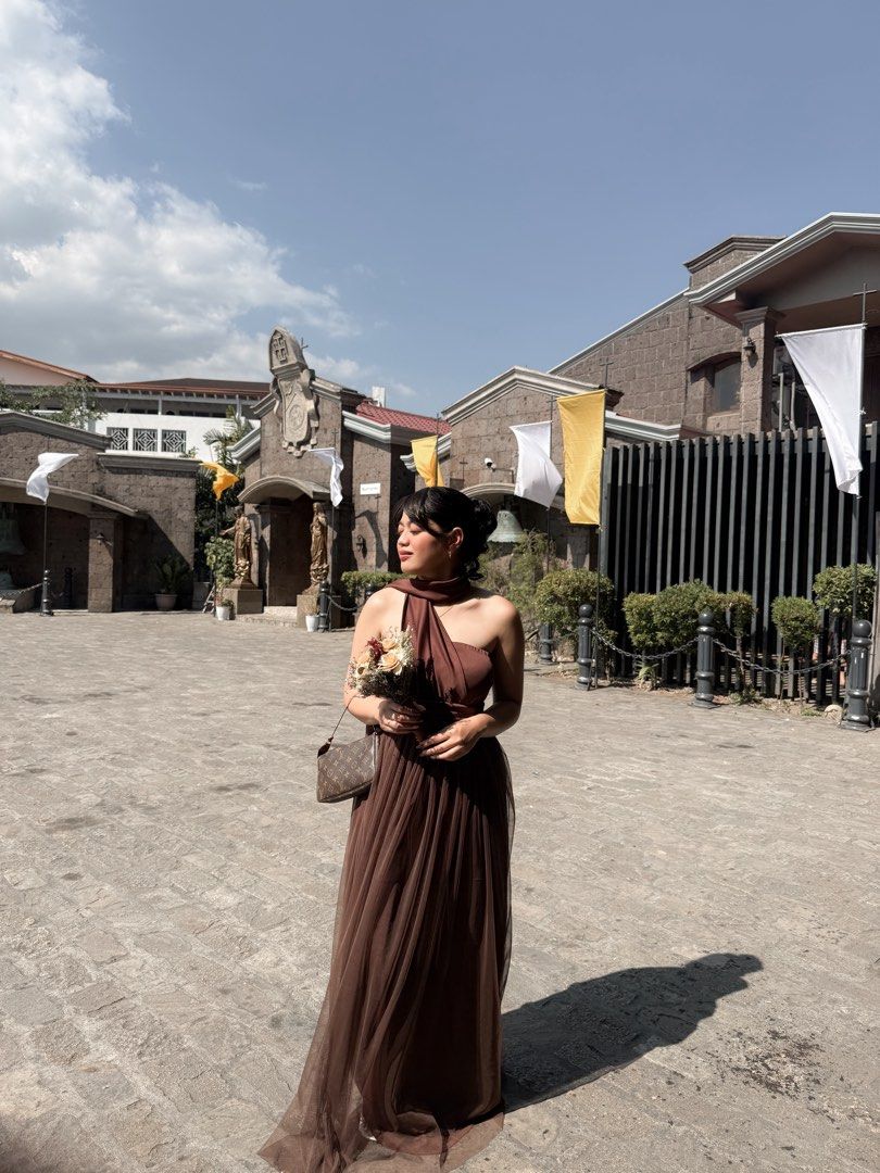 Brown One-Shoulder Tulle Maxi Dress (Category: Dresses) located in Manila. Submitted by cosmichorse.2280f0 (Listing ID 1458614282, Image 2). Description: - Elegant brown one-shoulder maxi dress - Features a flowing tulle skirt - Ideal for weddings, formal gatherings, and special events - Comfortable and chic design - Worn only once for a photoshoot.