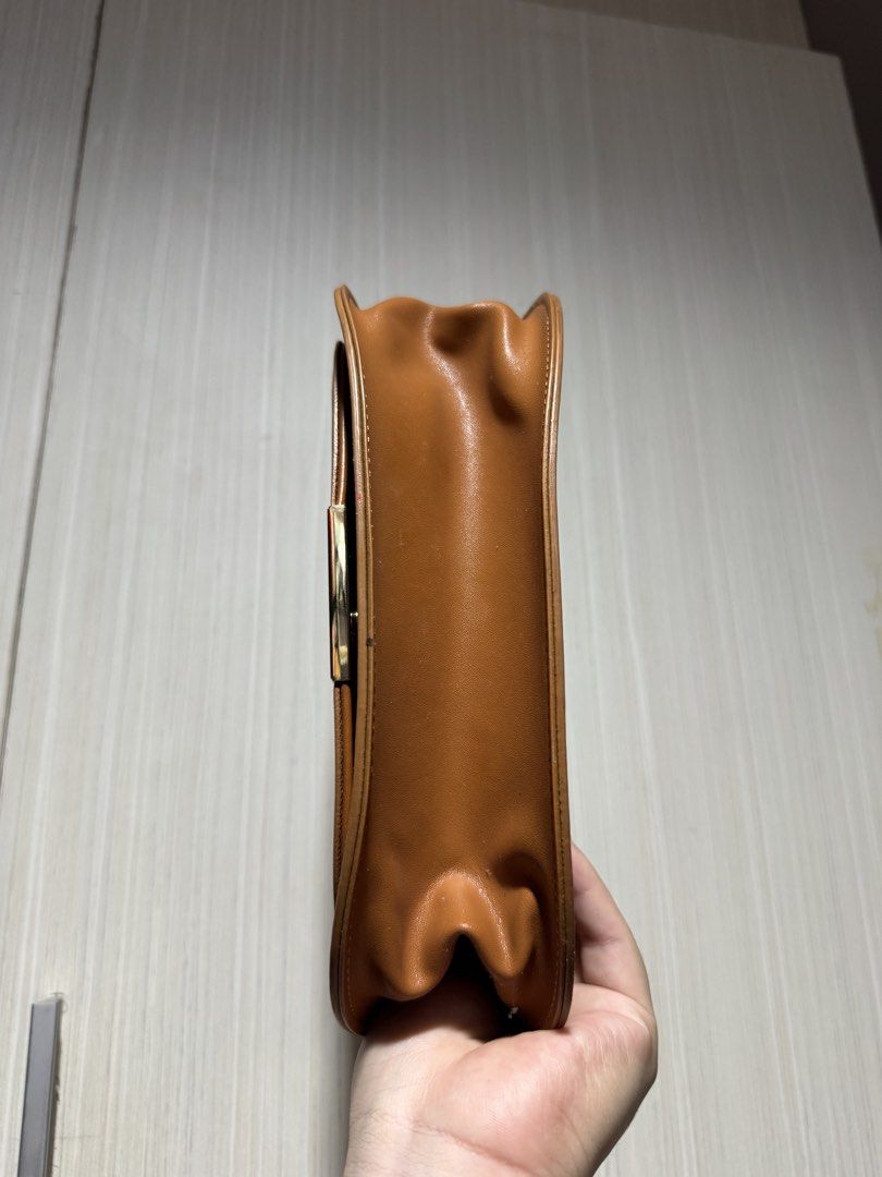 Brown Saddle Bag with Gold Clasp (Category: Luxury Bags & Wallets) located in Bacoor. Submitted by nicafindssince2022 (Listing ID 1458689368, Image 2). Description: - Cute brown saddle bag - Gold clasp closure - Faux leather material - Neat stitching - Minor signs of wear on flap edges (as pictured) - Ideal size for everyday essentials - Great for casual outings - With minimal signs of use.