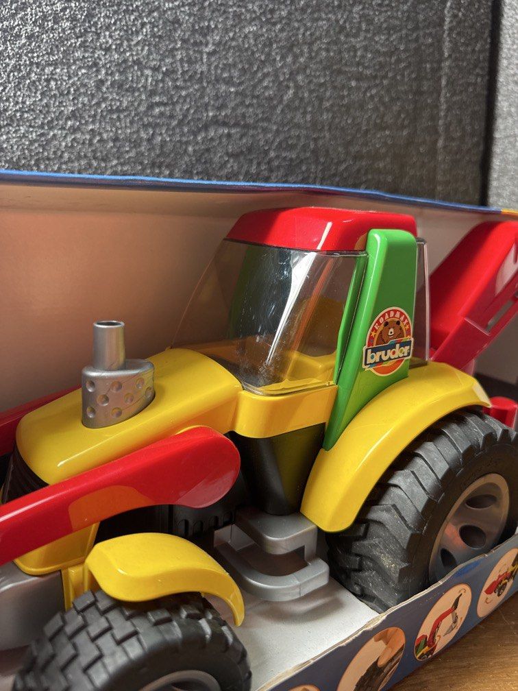 BRUDER Backhoe Loader truck (Made in Germany) (Category: Kids Toys) located in Manila. Submitted by aizco88 (Listing ID 1458569410, Image 2). Description: Bruder Roadmax Backhoe Loader. Suitable for children aged two years and older. Bruder tractor with fully functional front loader and backhoe. Also including an extending stabliser for those awkward areas! Complete with with soft rubber tyres. Scale:1:16 Size: 585mm x 183mm x 185mm Strong and st