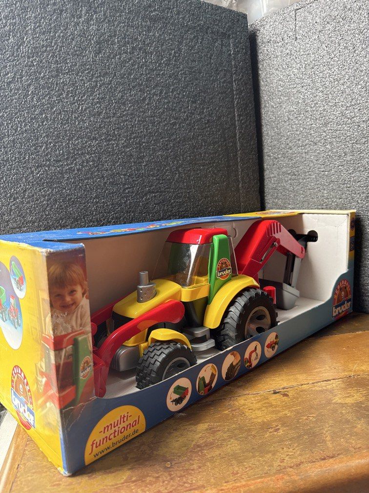 BRUDER Backhoe Loader truck (Made in Germany) (Category: Kids Toys) located in Manila. Submitted by aizco88 (Listing ID 1458569410, Image 1). Description: Bruder Roadmax Backhoe Loader. Suitable for children aged two years and older. Bruder tractor with fully functional front loader and backhoe. Also including an extending stabliser for those awkward areas! Complete with with soft rubber tyres. Scale:1:16 Size: 585mm x 183mm x 185mm Strong and st