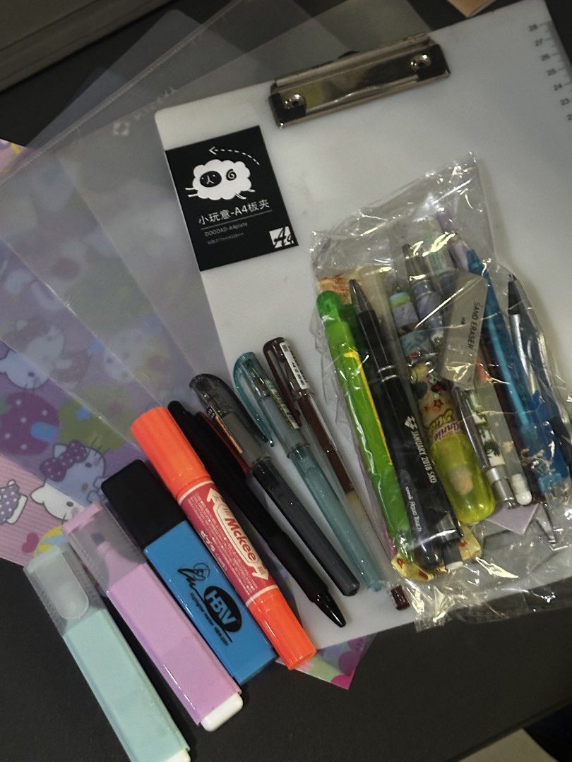 [BUNDLE] Assorted Pens, Highlighters, and A4 Folder (Category: Stationery & School Supplies) located in Manila. Submitted by sharksfin06 (Listing ID 1458518195, Image 1). Description: Mitsubishi pens, tombow, docomo frixion highlighter, colorful sakura pen and red multipen not working. Others are in good condition Rubber eraser not avail - Bundle includes: assorted pens, highlighters (orange, blue, pink, mint green), clear A4 folder with cute she
