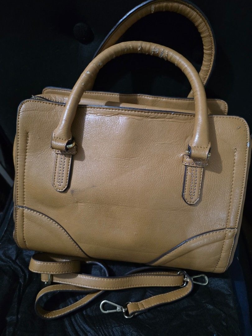 Camel Leather 2 way Bag (Category: Shoulder Bags) located in Quezon City. Submitted by cottoncandyqc (Listing ID 1458679620, Image 2). Description: includes strap for cross body or shoulder bag use lining and inner pockets mint condition support, rivets, zippers and other hardware still shiny with luster some scratches/peel in leather corners but not halata especially when worn cubao qc for lalamove j&t .