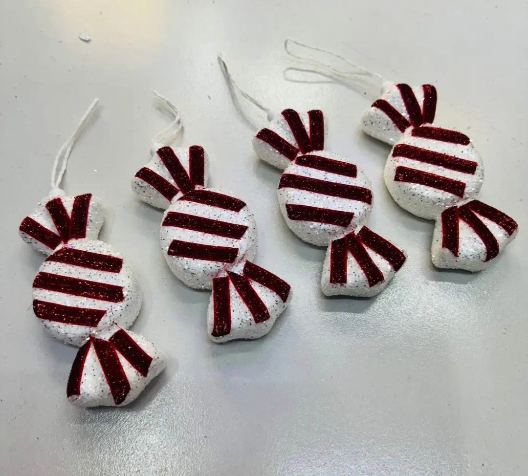 Candy Cane & Lollipop Christmas Tree Ornaments Set (Category: Other Home Decor) located in Manila. Submitted by mecagani (Listing ID 1458649309, Image 3). Description: - candy cane and lollipop themed Christmas tree ornaments. - Includes various sizes and designs for a festive candy land theme. - Features large candy canes, lollipops, and smaller swirl candies. - Adds a sweet touch to your holiday decor..