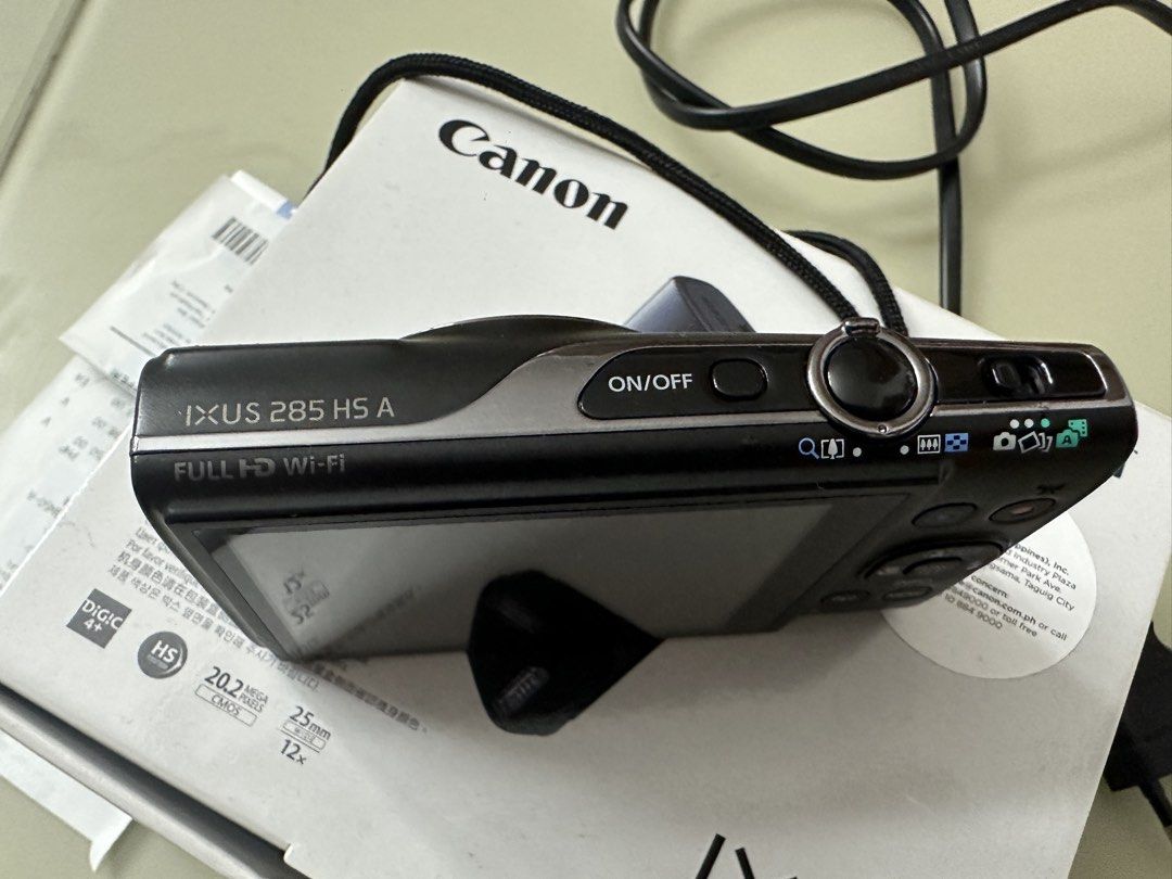 Canon IXUS 285 HS A Digital Camera (Category: Cameras) located in Quezon City. Submitted by lovedbyssy (Listing ID 1458631350, Image 3). Description: - Canon IXUS 285 HS Digital Camera - 20.2 Megapixels resolution - 12x Optical Zoom - Full HD Video Recording - Built-in Wi-Fi for easy sharing - Comes with charger and original box - Ideal for everyday photos and travel Slightly negotiable, open for meet up.