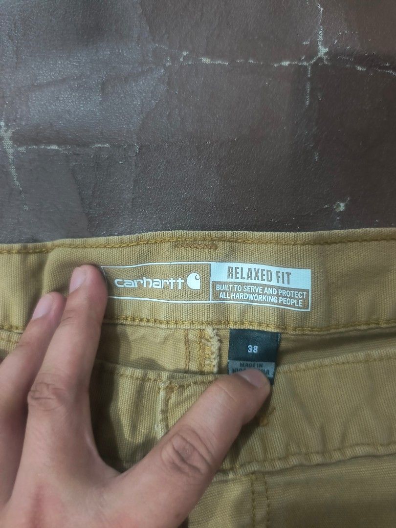 Carhartt short size 38 (Category: Announcements) located in Cagayan de Oro. Submitted by jamesb2854 (Listing ID 1458639593, Image 3). Description: These appear to be a pair of tan Carhartt Rugged Flex relaxed fit canvas work shorts featuring a durable utility pocket on the side. Good condition No issue.