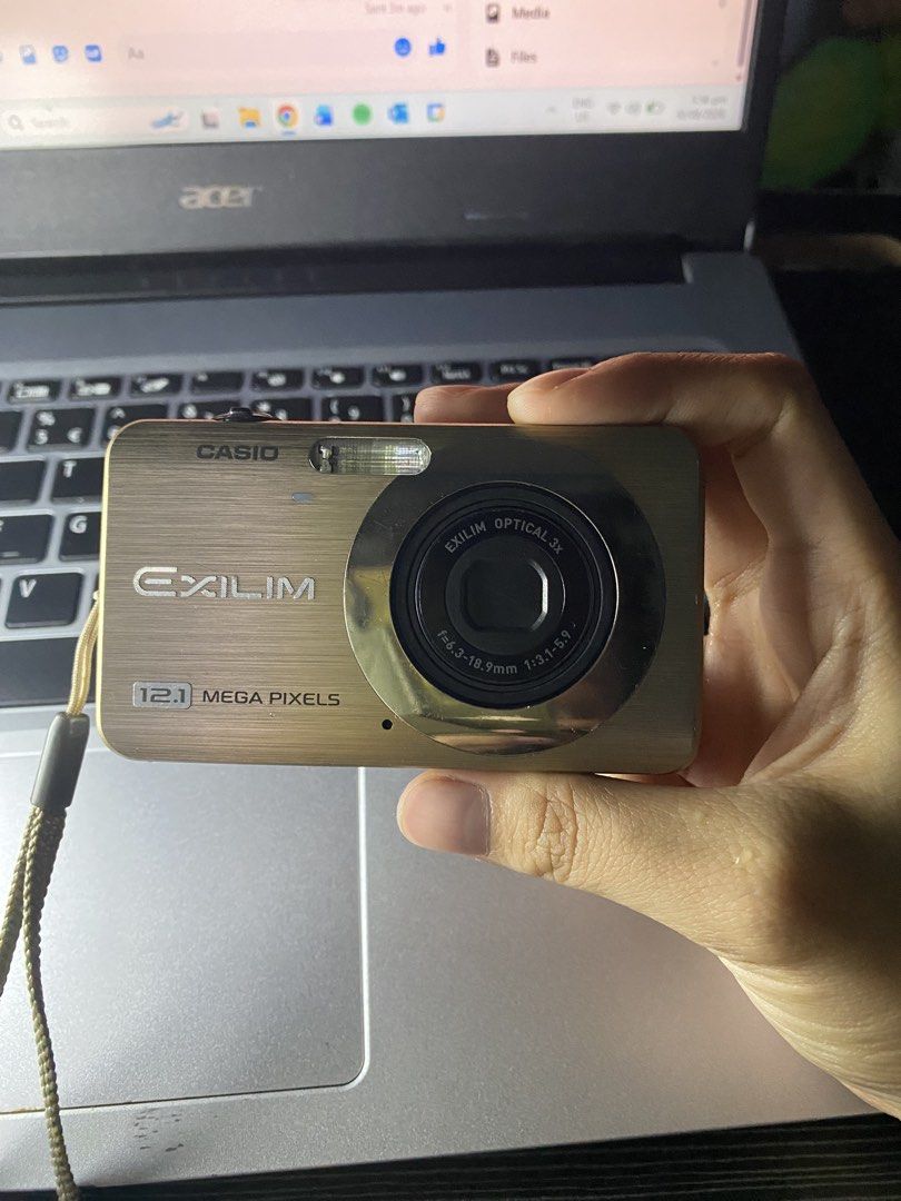 Casio EXILIM (Category: Cameras) located in Bacoor. Submitted by zsdeclutting (Listing ID 1458602413, Image 2). Description: Gold Casio Exilim RFS: Decluttering, Family Owned Flash working Buttons working Cosmetics 9/10 ISSUE: - may mga tiny black dots sa screen, it doesn’t really affect anything tho. Inclusions: New Battery SD Card Lanyard The Cam Itself Original Charger (working, but need sya sa pinaka top ilalagay, can’t explain clearly, I can