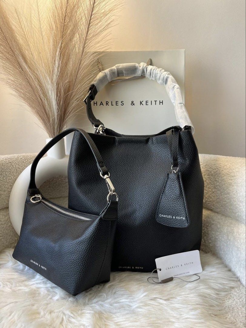 Charles & keith 2 pcs Bag Set (Category: Shoulder Bags) located in Pasig City. Submitted by preloved.closet2 (Listing ID 1458685815, Image 1). Description: Shoulder Bag and Mini bag Color black .
