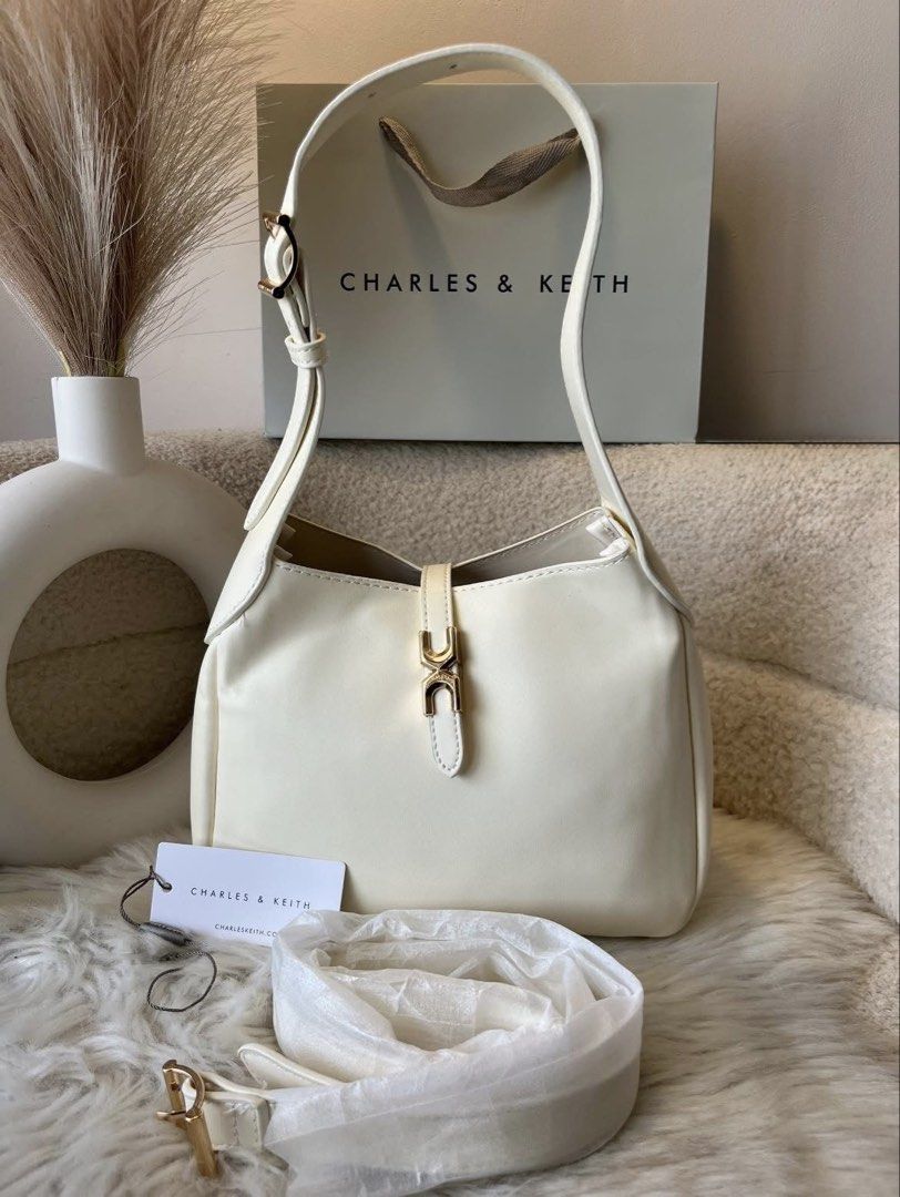 Charles & Keith Mini Hobo Bag - Cream (Category: Shoulder Bags) located in Pasig City. Submitted by preloved.closet2 (Listing ID 1458685333, Image 1). Description: Size 8 inches Color Cream With Sling .