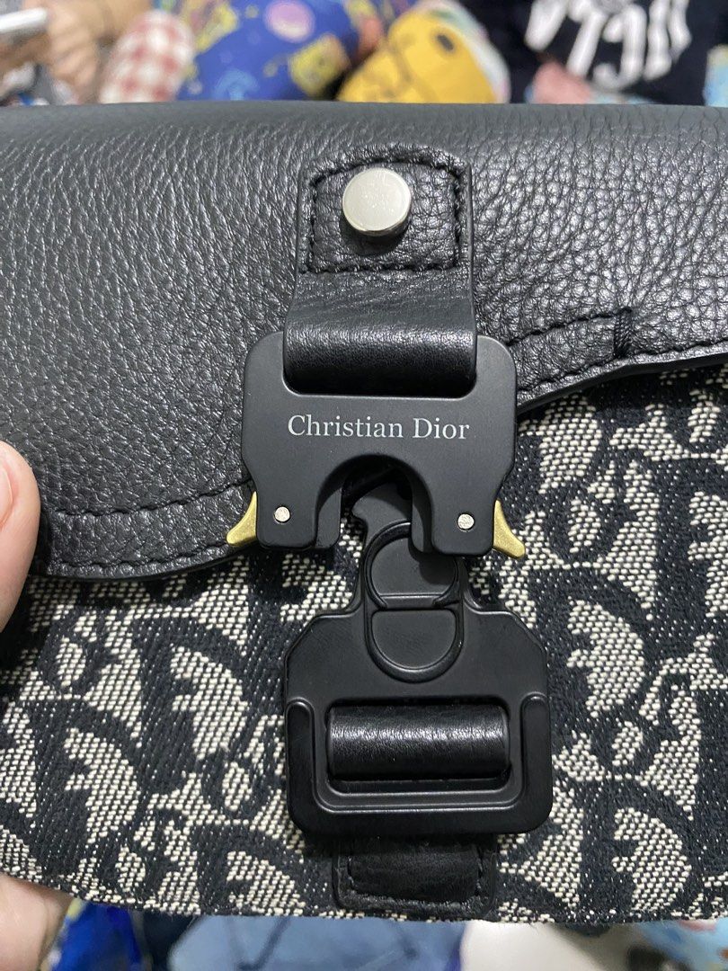 Christian Dior Saddle Bag Oblique Canvas (Category: Luxury Bags & Wallets) located in Manila. Submitted by hell_market (Listing ID 1458663738, Image 3). Description: - Iconic Dior Saddle Bag - Signature Oblique canvas (black & grey) - Black leather trim and strap - Classic CD buckle closure - Interior Dior leather tag - Stylish and practical for daily use.