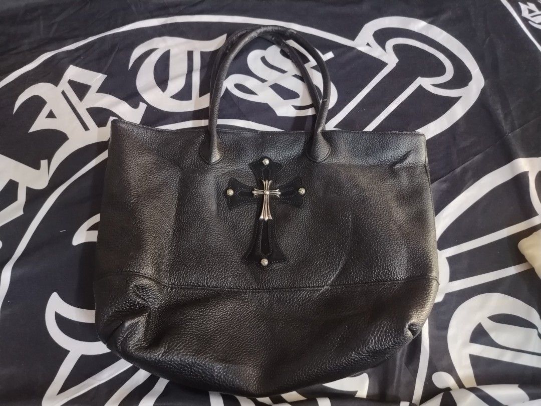 Chrome hearts leather tote bag (Category: Tote Bags) located in Roxas City. Submitted by hd_thriftshop (Listing ID 1458541889, Image 1). Description: Chrome hearts leather tote bag featuring a prominent silver-toned cross emblem with studded details,.