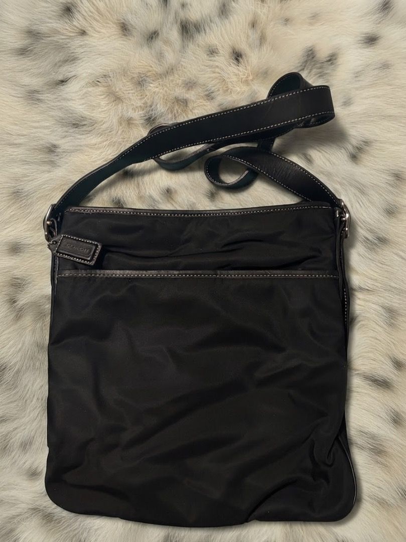 Coach Black Nylon Crossbody / Messenger Bag (Category: Luxury Bags & Wallets) located in Caloocan City. Submitted by dahliaeloise (Listing ID 1458611321, Image 1). Description: Authentic Coach Black Nylon Crossbody / Messenger Bag— Preloved by me^^ DISCLAIMERS: 𝜗𝜚 irresponsible buyers = blocked 𝜗𝜚 shipping via J&T 𝜗𝜚 shipping is shouldered by the buyer.