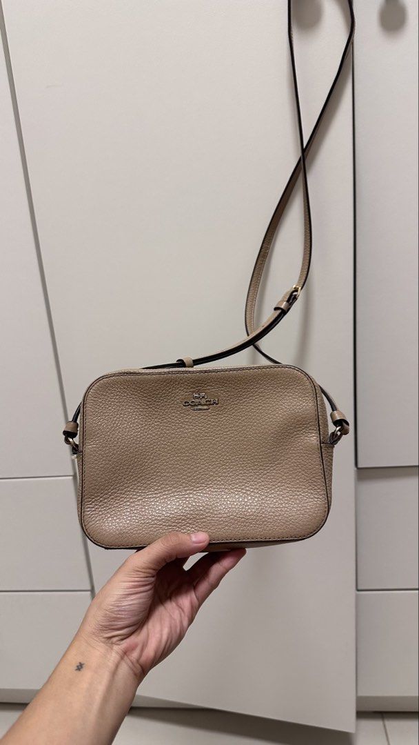 Coach Camera Bag in Taupe Pebbled Leather (Category: Cross-body Bags) located in Muntinlupa City. Submitted by shop.me.11 (Listing ID 1458626590, Image 3). Description: Authentic Coach camera bag in a soft taupe/beige pebbled leather with gold hardware. Compact crossbody silhouette — perfect for everyday use or travel when you want to go light..