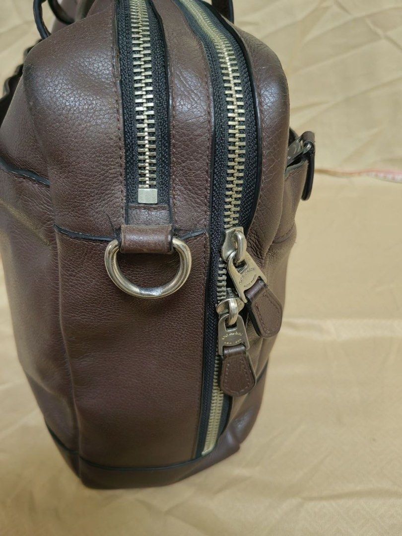 Coach Dark Brown Leather Briefcase (Category: Briefcases) located in Manila. Submitted by junejanuary (Listing ID 1458499190, Image 3). Description: - Classic Coach dark brown leather briefcase - Classic design with top handles - Secure zip closure - Spacious interior for work essentials - Beautiful leather patina developed over time - A durable and reliable bag for daily commutes.