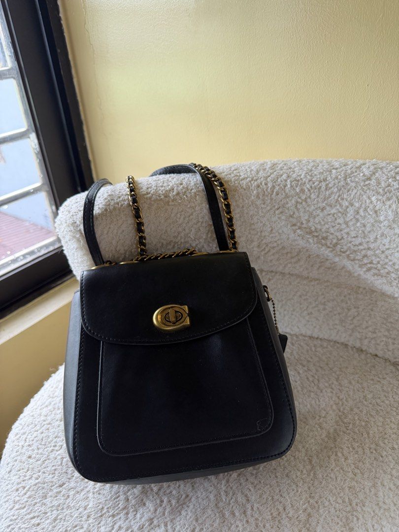 Coach Madison Convertible Backpack 18 (Category: Luxury Bags & Wallets) located in Bulacan. Submitted by milobearrr (Listing ID 1458582478, Image 3). Description: - Genuine black leather Coach bag - Elegant gold hardware - Secure front turnlock closure - Convenient interior zippered pocket - Adjustable chain strap for versatile wear - Includes original Coach leather tag - Ideal for everyday use and evening events - issue yung turnlock po gasgas n