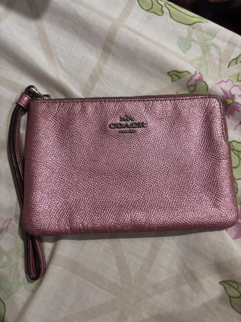 Coach Pink Metallic Wristlet (Category: Wallets & Card holders) located in Las Pinas. Submitted by kylloren_ (Listing ID 1458608891, Image 2). Description: - bought from outlet store :) - 1st pic is just for inspo - still negotiable for sure buyers - shipping is thru j&t.