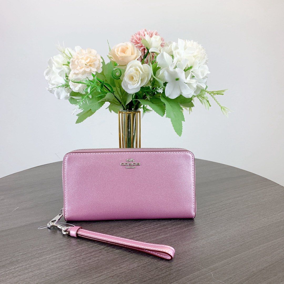 Coach Pink Metallic Wristlet (Category: Wallets & Card holders) located in Las Pinas. Submitted by kylloren_ (Listing ID 1458608891, Image 1). Description: - bought from outlet store :) - 1st pic is just for inspo - still negotiable for sure buyers - shipping is thru j&t.