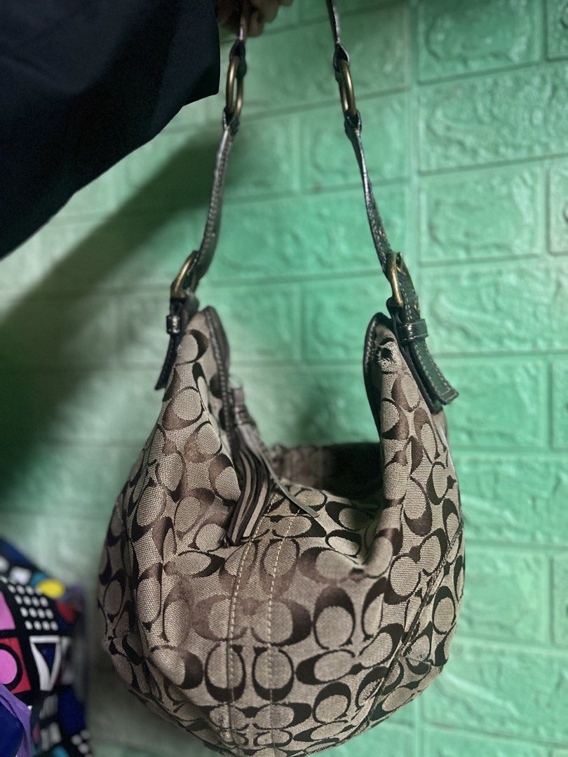 Coach Signature Monogram Hobo Bag (Category: Luxury Bags & Wallets) located in Manila. Submitted by _ayish21 (Listing ID 1458530619, Image 1). Description: - Classic Coach hobo bag - Signature monogram pattern - Leather trim and strap - Gold hardware - Zipper closure - Interior zip pocket and slip pockets - Ideal for everyday use.