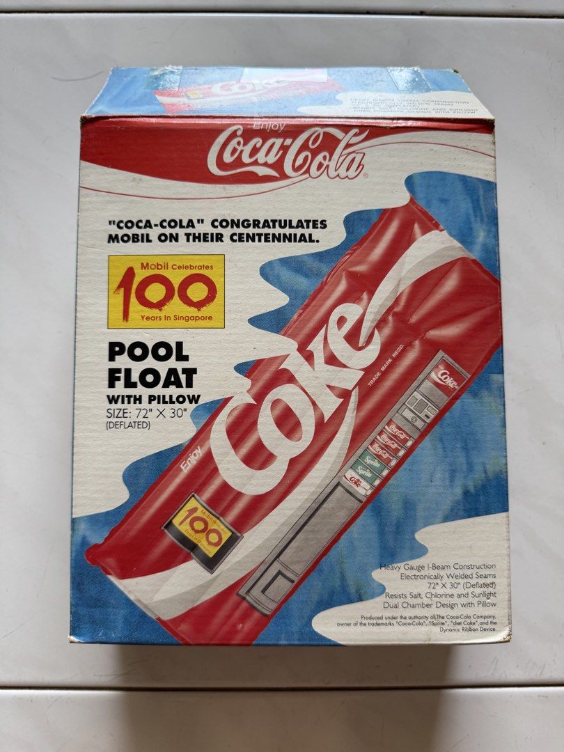 Coca-Cola Pool Float (Category: Other Sports Equipment and Supplies) located in Singapore. Submitted by ndabsolute (Listing ID 1458564463, Image 3). Description: - Vintage Coca-Cola Pool Float - Special Edition: Celebrates Mobil's 100 Years in Singapore - Heavy Gauge I-Beam Construction for durability - Dual Chamber Design with built-in pillow - Resists Salt and Sun damage - Size: 72" x 30" (deflated) - Made in China under license from The Coca-C