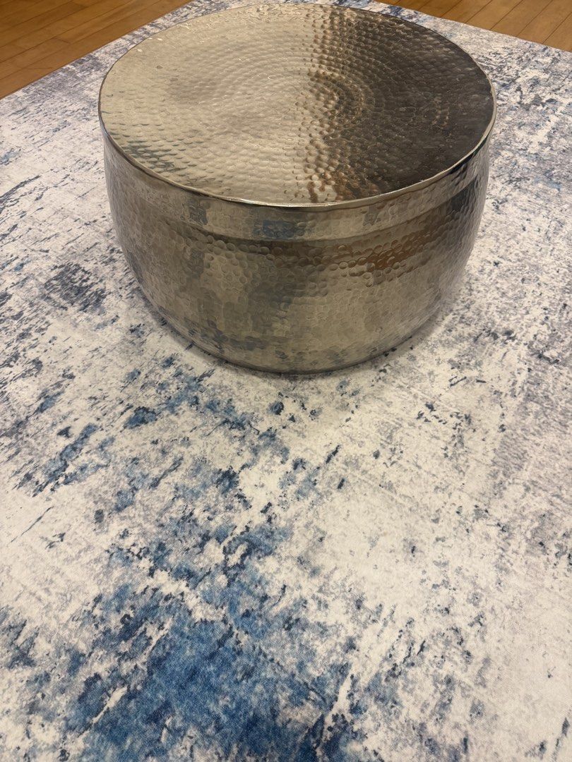 Coffee table (Category: Tables & Sets) located in Singapore. Submitted by plerch (Listing ID 1458524717, Image 1). Description: - Stylish hammered metal coffee table - Unique textured surface for a modern look - Versatile for placing drinks, books, or decor.