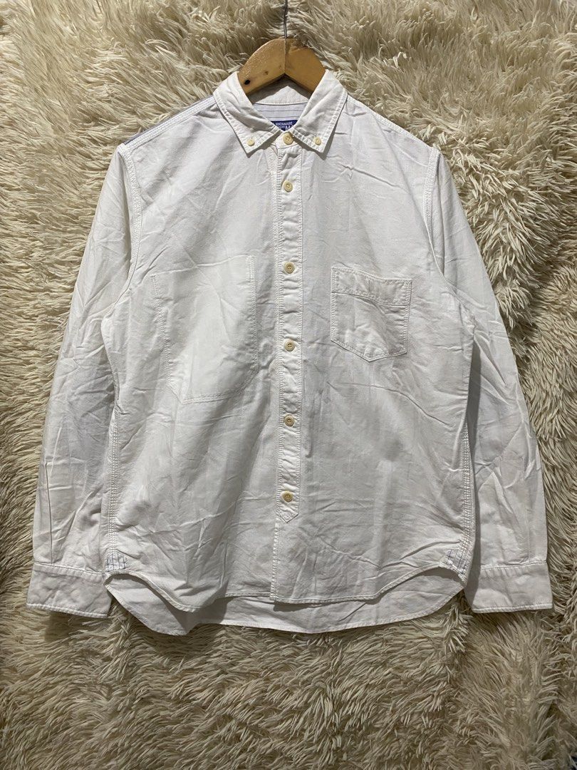 COMME des GARÇONS White Button-Up Shirt Size M (Category: Shirts) located in Manila. Submitted by switchcity (Listing ID 1458613892, Image 1). Description: - Brand: COMME des GARÇONS - Color: White - Style: Long-sleeved button-up shirt - Features: Classic collar, chest pocket - Unique Detail: Contrasting blue panel across the back shoulders - Origin: Made in Japan - Size: M - Occasion: Versatile for casual or smart-casual wear.