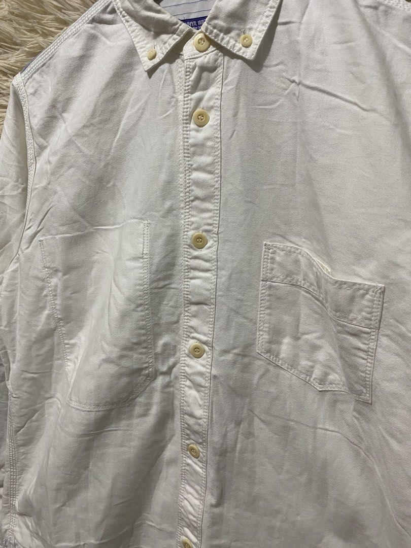 COMME des GARÇONS White Button-Up Shirt Size M (Category: Shirts) located in Manila. Submitted by switchcity (Listing ID 1458613892, Image 3). Description: - Brand: COMME des GARÇONS - Color: White - Style: Long-sleeved button-up shirt - Features: Classic collar, chest pocket - Unique Detail: Contrasting blue panel across the back shoulders - Origin: Made in Japan - Size: M - Occasion: Versatile for casual or smart-casual wear.