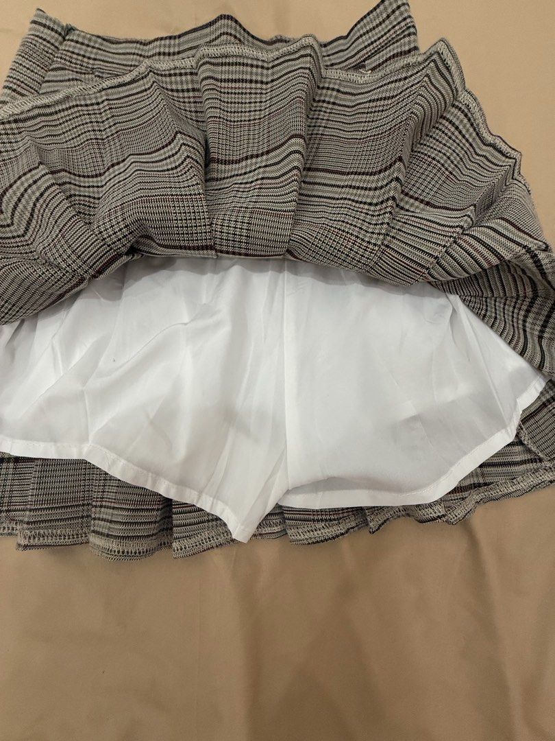 Dazy Plaid Pleated Mini Skirt Size S (Category: Skirts) located in Quezon City. Submitted by _cmls (Listing ID 1458538238, Image 3). Description: - Brand: Dazy - Style: Plaid Mini Skirt - Size: S - Features: All-around pleats, built-in lining - Versatile: Great for casual wear or dressing up - Easy to pair with various tops.