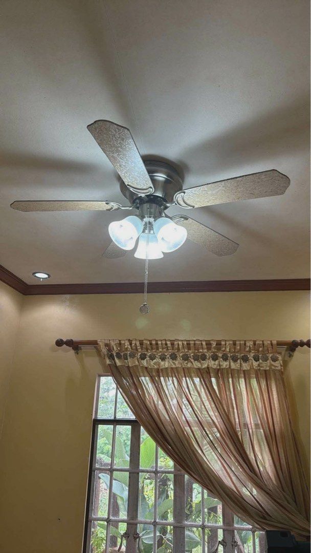 Decorative ceiling fan with lights (Category: Fans) located in Batangas. Submitted by cinnacoll (Listing ID 1458562757, Image 2). Description: - 5-blade ceiling fan with built-in lights (turned on via pull chain) - Fan and lights are fully functional - Very minor/small scratches. Unnoticeable - Price can be negotiable - Can do meetups (Lipa City) or delivery via LBC RFS: Renovation and redecorating house.