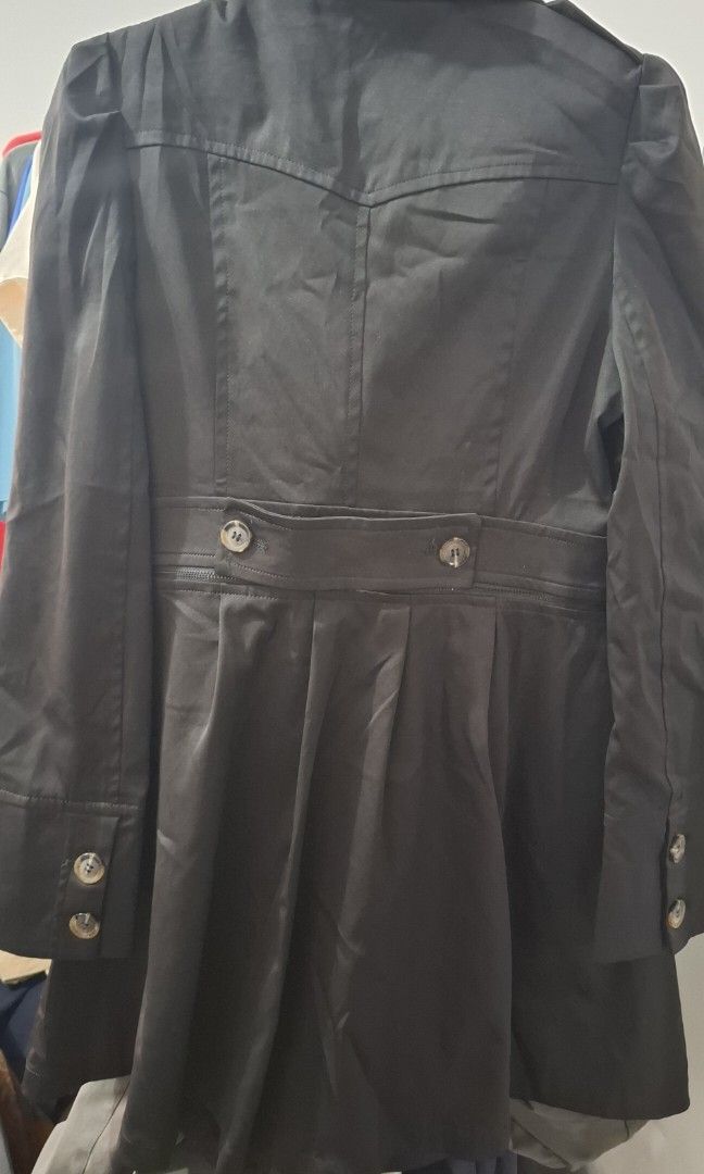 Designer Double-Breasted Trench Coat - Black (Category: Coats, Jackets and Outerwear) located in Bulacan. Submitted by ditchandswitch (Listing ID 1458627404, Image 3). Description: - Classic black double-breasted trench coat - Belted waist for a flattering silhouette - Elegant pleated skirt - Adorable bow zipper charm with rhinestones - Fun leopard print inner lining - Ideal for layering and adding a touch of sophistication to any outfit RFS: Dec