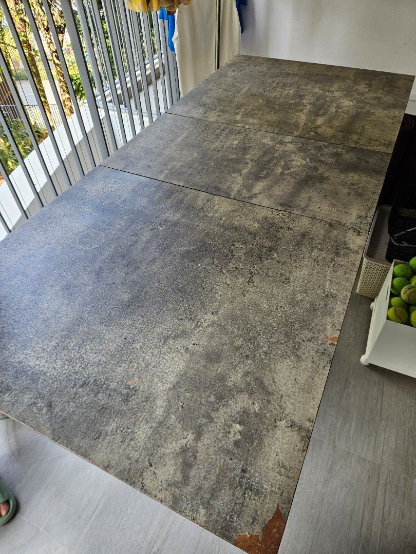 Extendable Dining Table (Category: Tables & Sets) located in Singapore. Submitted by rayne8 (Listing ID 1458578359, Image 2). Description: - Dining table with a unique concrete-like finish - Textured, mottled grey tabletop - Versatile: perfect for dining or as a workspace - Features sturdy black metal legs - Length 140cm - 180cm (extendable) - Width 80cm.