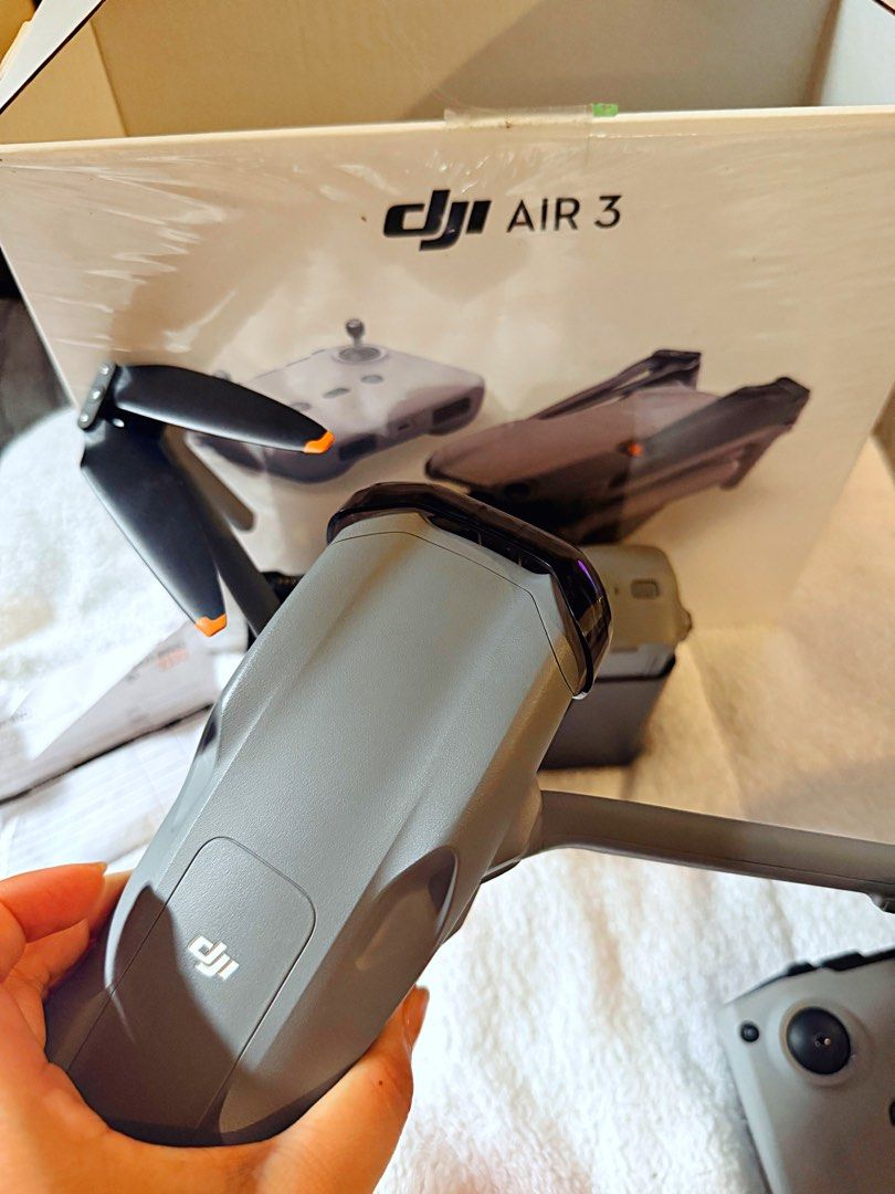 DJI Air 3 Drone (4 mins flight time only, almost new) (Category: Drones) located in Cabuyao City. Submitted by cleaningoutmycloset.ph (Listing ID 1458514576, Image 3). Description: DJI Air 3 - Almost new, 4 minutes flight time only - Includes RC 2 Controller, Orig Box - Multiple Batteries Included - 2 Sets of Unused Extra Propellers - Weekend meetups only at Nuvali or Molito RFS: As shown, only used for 4 minutes since we bought it. We only used 