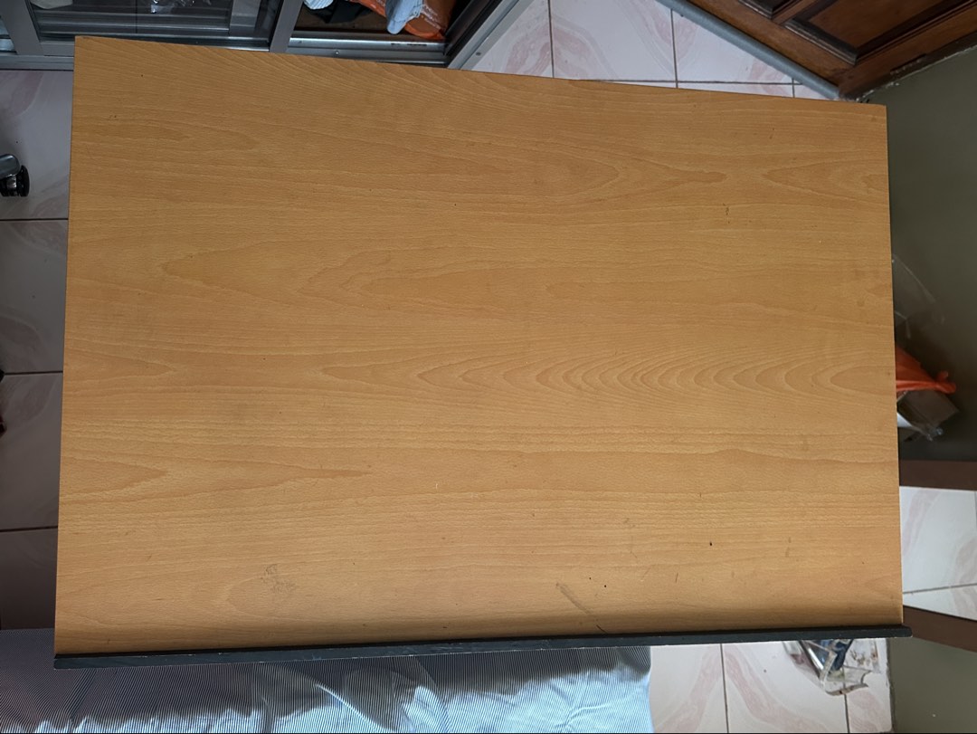 Drafting Table (Category: Tables & Sets) located in Imus. Submitted by bleakblob (Listing ID 1458674354, Image 2). Description: - Adjustable wooden drawing table with customizable height and angle. - Features a smooth, ready-to-use surface for all your creative projects. - Light ink marks are visible on the surface but the surface is still smooth and ideal for drafting..