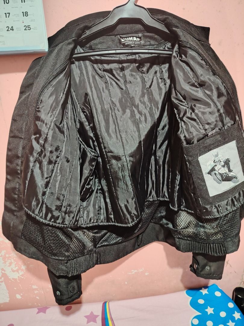DUHAN Custom Leathers Motorcycle Jacket Long Beach California (Category: Coats, Jackets and Outerwear) located in Caloocan City. Submitted by wisedragon_31f86a (Listing ID 1458544143, Image 3). Description: - Black DUHAN motorcycle jacket - Features 'Custom DUHAN Leathers' and 'Long Beach California' graphics - Includes Honda and other racing patches - Front zip closure - Ideal for motorcycle riding.