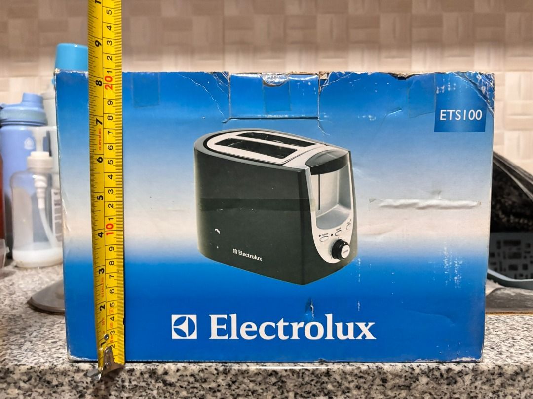 Electrolux ETS100 2-Slice Toaster (Category: Ovens & Toasters) located in Makati City. Submitted by jed.castillo (Listing ID 1458542851, Image 2). Description: - Electrolux ETS100 Toaster - Stylish black and silver design - Two (2) bread slots - Adjustable browning control dial - Comes in original packaging (box shows some wear from storage) - Ideal for making perfect toast.