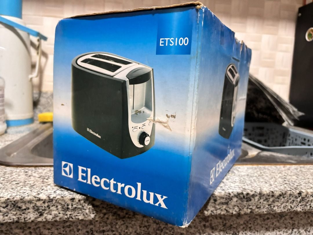 Electrolux ETS100 2-Slice Toaster (Category: Ovens & Toasters) located in Makati City. Submitted by jed.castillo (Listing ID 1458542851, Image 1). Description: - Electrolux ETS100 Toaster - Stylish black and silver design - Two (2) bread slots - Adjustable browning control dial - Comes in original packaging (box shows some wear from storage) - Ideal for making perfect toast.