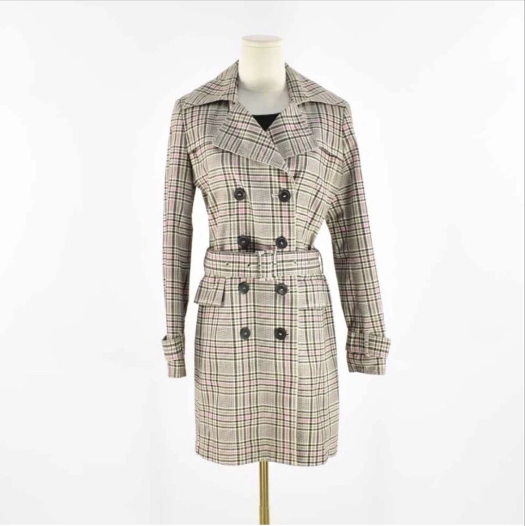 Esprit Collection Plaid Double-Breasted Trench Coat (Category: Coats, Jackets and Outerwear) located in Makati City. Submitted by refind.prelove.finds (Listing ID 1458647827, Image 1). Description: - Classic plaid trench coat - Double-breasted design - Belted waist for a cinched look - Knee length - Features a stylish pink lining - Ideal for layering and adding a sharp, stylish touch to any outfit.
