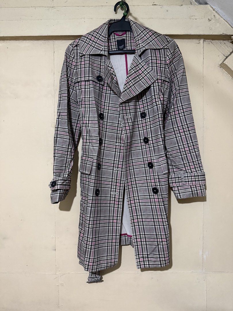 Esprit Collection Plaid Double-Breasted Trench Coat (Category: Coats, Jackets and Outerwear) located in Makati City. Submitted by refind.prelove.finds (Listing ID 1458647827, Image 2). Description: - Classic plaid trench coat - Double-breasted design - Belted waist for a cinched look - Knee length - Features a stylish pink lining - Ideal for layering and adding a sharp, stylish touch to any outfit.