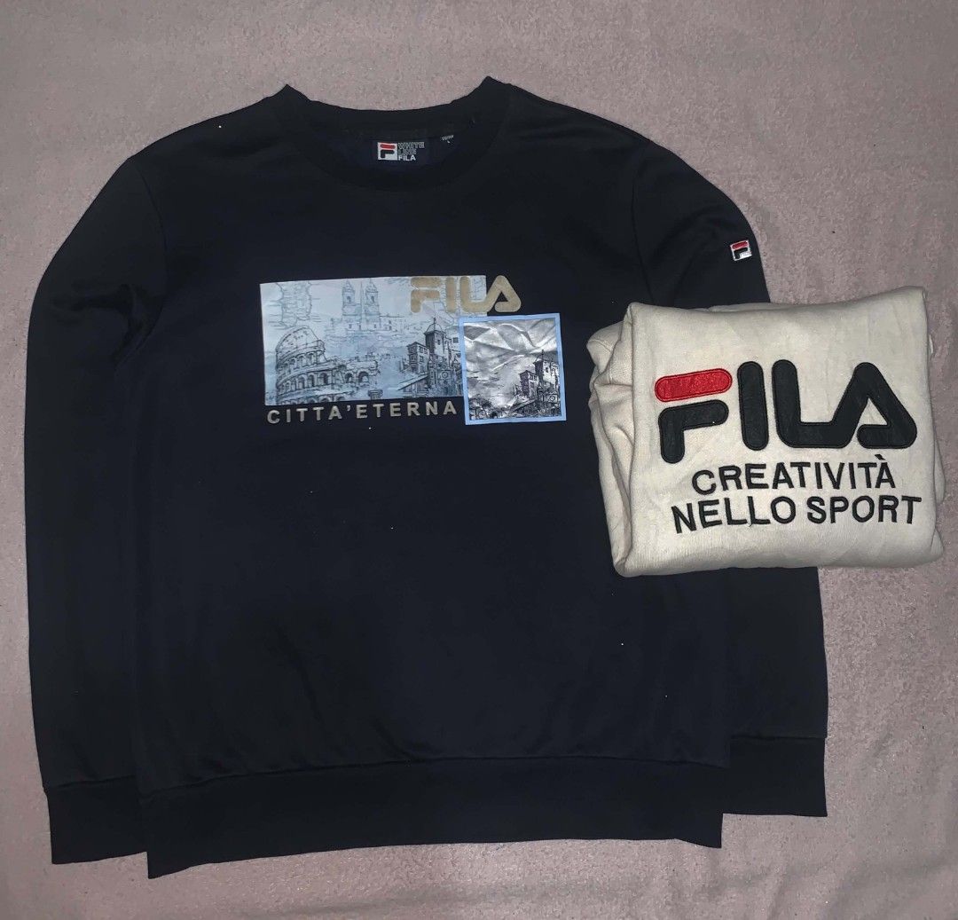 Fila Hoodie and Sweatshirt Bundle (Category: Coats, Jackets and Outerwear) located in Manila. Submitted by ukayd_vntg_thrft_2.0 (Listing ID 1458678668, Image 3). Description: - Fila Cream Hoodie: Features iconic Fila logo and Italian text. Comfortable and stylish for everyday wear. - Fila Black Sweatshirt: Showcases a unique graphic print of Roman landmarks with Italian text. Perfect for a stylish casual look. - Both items are designed for ultima