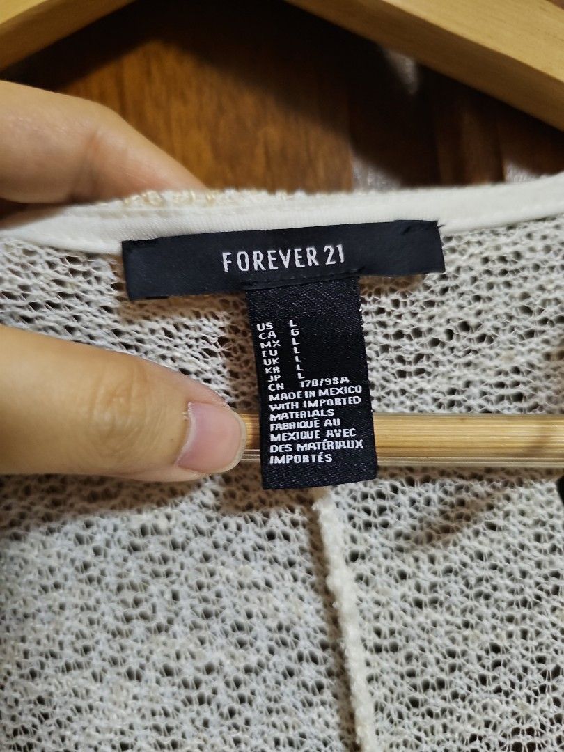 Forever 21 Cream Knit Cardigan (Category: Coats, Jackets and Outerwear) located in Valenzuela. Submitted by jochaaa011 (Listing ID 1458613896, Image 2). Description: - Lightweight cream knit cardigan - Open front style - Long sleeves - Subtle textured knit pattern - Ideal for layering over any outfit - Comfortable and easy to wear.