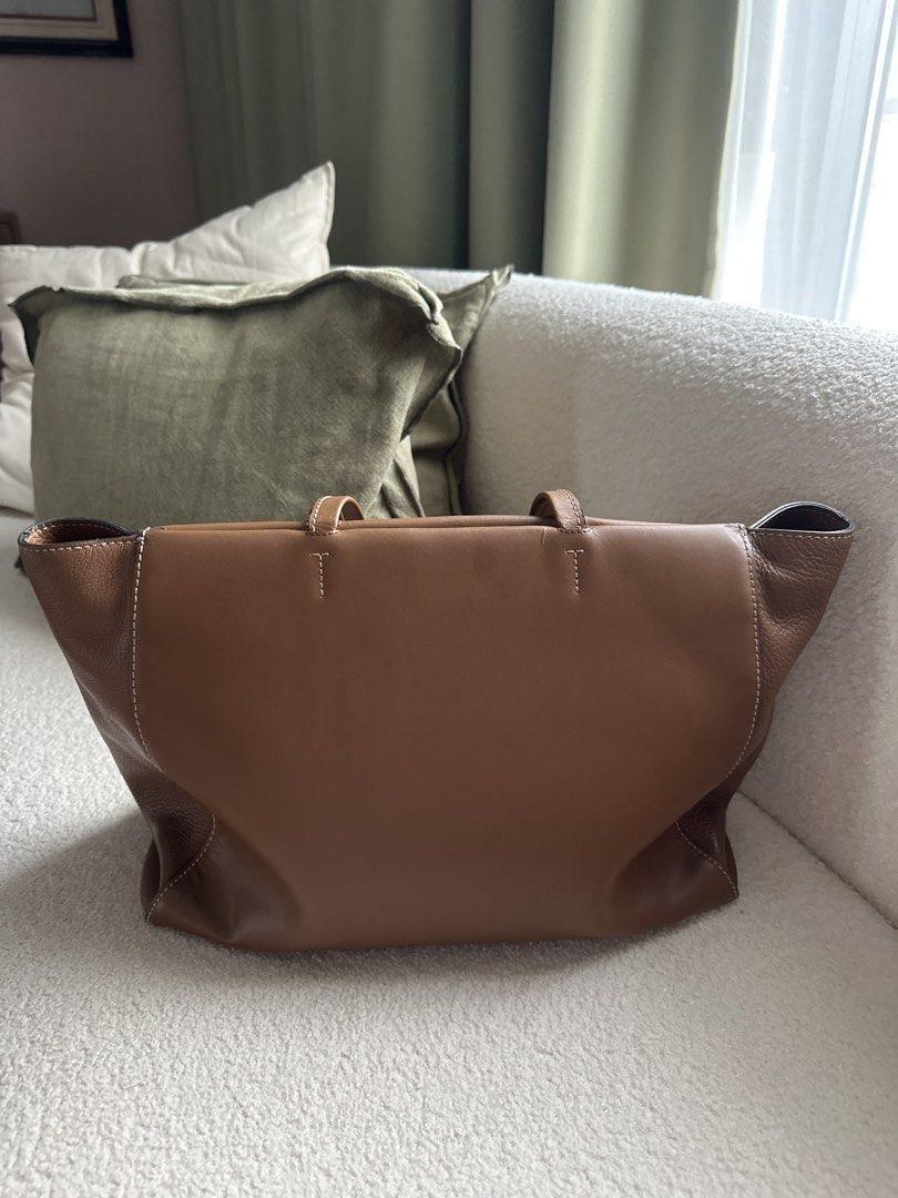 Furla Leather Tote Bag - Brown (Category: Luxury Bags & Wallets) located in Caloocan City. Submitted by dmqwear (Listing ID 1458568205, Image 2). Description: - Authentic Furla brown leather tote bag - Pebbled leather sides, smooth leather front/back - Secure zip closure - Spacious interior for all your essentials - Four protective metal feet on the bottom - Heavily used thus the wear on top edges near the zipper but this can be refurbished.