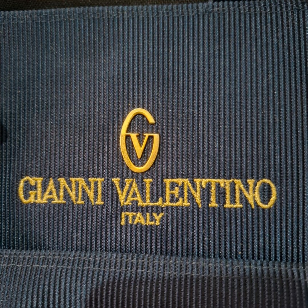 Gianni Valentino Navy Blue Bag (Category: Shoulder Bags) located in Baliuag. Submitted by ahgashop. (Listing ID 1458535428, Image 3). Description: - Navy blue Gianni Valentino bag from Japan - Features elegant gold hardware - Unique textured design and spacious - Ideal for everyday use.