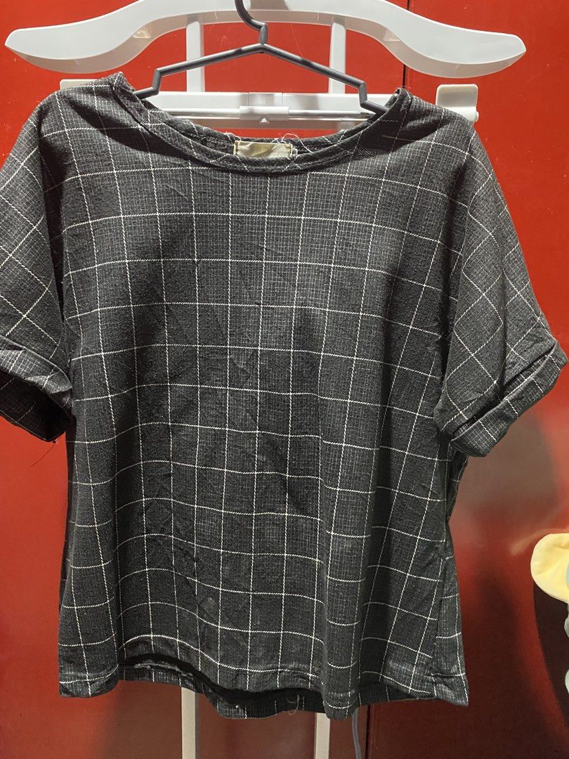 Grey Plaid Short Sleeve Top (Category: Blouses) located in Bauang. Submitted by nrrandomthings (Listing ID 1458659089, Image 1). Description: - Grey top with a chic white grid pattern. - Features short sleeves with a stylish rolled cuff. - Classic round neckline for a versatile look. - Comfortable textured fabric, ideal for daily wear. - Effortlessly pairs with jeans or skirts for various outfits..