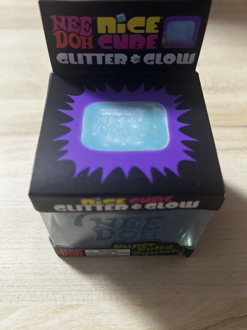 GUARANTEED AUTHENTIC:Schylling Nee Doh Nice Cube by Glitter & Glow Super Solid Squish Toy (Category: Interactive Toys) located in Pateros City. Submitted by thesisties (Listing ID 1458587865, Image 2). Description: -Bought from US - Nee Doh Nice Cube: Glitter & Glow Edition - Super solid yet satisfyingly squishy texture - Features shimmering glitter and glows in the dark - Excellent sensory toy for stress relief and fidgeting - Perfect for both k