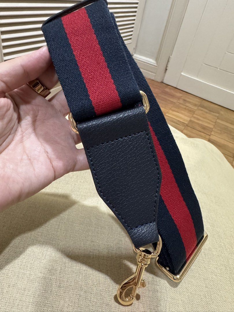 Gucci Navy Red Stripe Leather Strap (Category: Luxury Bags & Wallets) located in Cebu City. Submitted by toteladyph (Listing ID 1458582577, Image 1). Description: **OG Quality** Gucci Navy & Red Web Stripe Bag Strap / Shoulder Strap Note: Retail is 25k Classic Gucci-inspired navy blue and red web stripe bag strap with leather trim and gold-tone hardware. A great way to refresh or customize a handbag while adding a sporty-luxe designer look. Detai