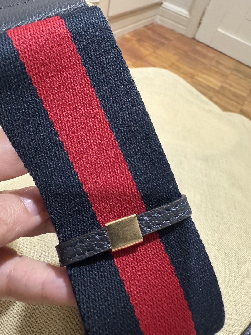 Gucci Navy Red Stripe Leather Strap (Category: Luxury Bags & Wallets) located in Cebu City. Submitted by toteladyph (Listing ID 1458582577, Image 2). Description: **OG Quality** Gucci Navy & Red Web Stripe Bag Strap / Shoulder Strap Note: Retail is 25k Classic Gucci-inspired navy blue and red web stripe bag strap with leather trim and gold-tone hardware. A great way to refresh or customize a handbag while adding a sporty-luxe designer look. Detai